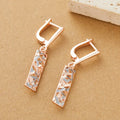 Rectangular two-tone hollow geometric alloy stud earrings for women with electroplated finish.