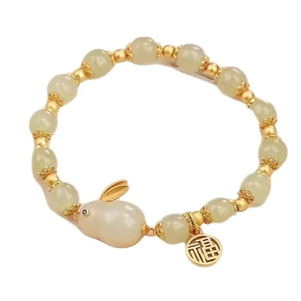 Green jade hare bracelet with fu character pendant on black hand-braided band