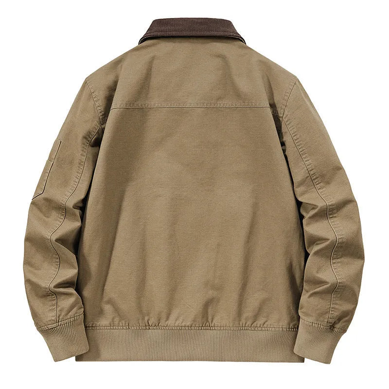 Men's beige washed cotton baseball style flight jacket on a hanger, showing classic design.