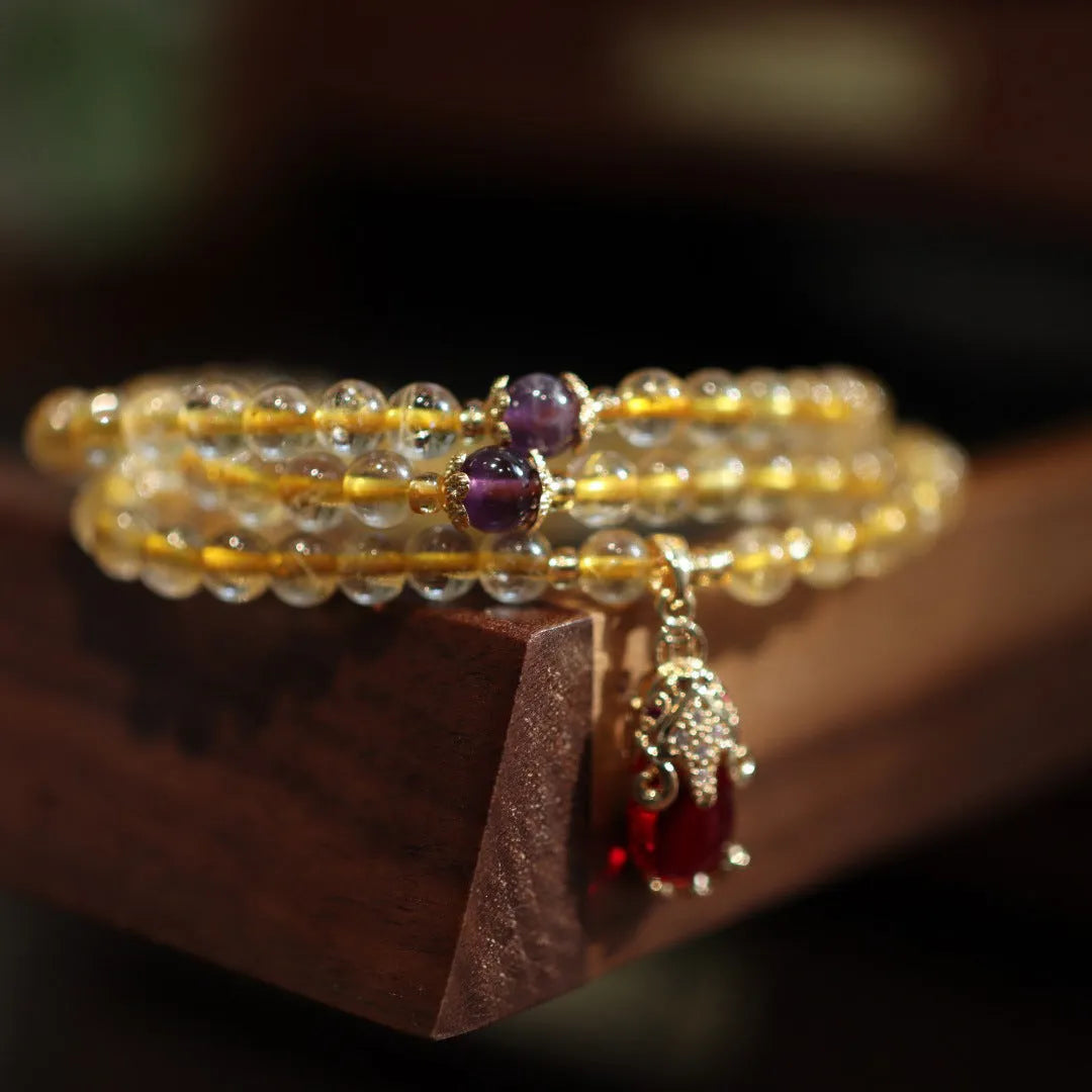 Natural Brazilian gold rutilated quartz bracelet with three-circle gold and ruby quartz design