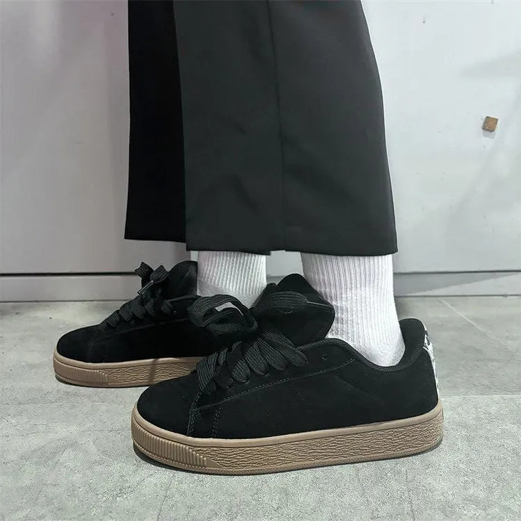 Black retro low-top sneakers with waterproof platform soles and round toe design