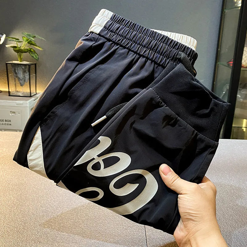 Men's black cropped ankle banded trousers in ultra-thin ice silk cotton fabric