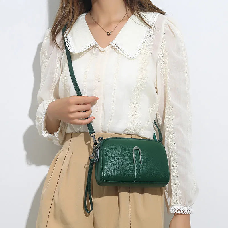 Black genuine leather women's square shoulder bag with a structured horizontal shape