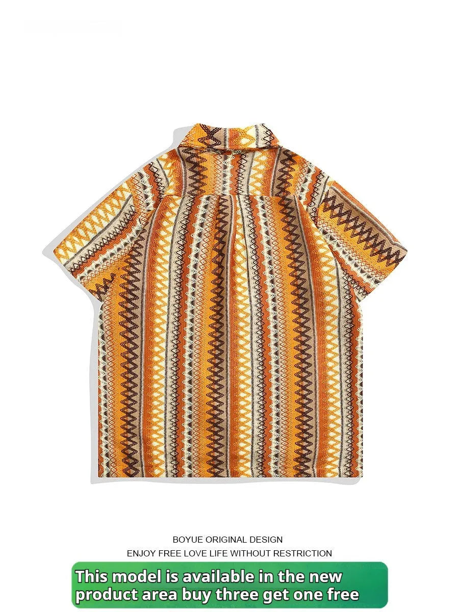 Man modelling a light-coloured ethnic patterned Cuban collar shirt with contrast colours and drop shoulders