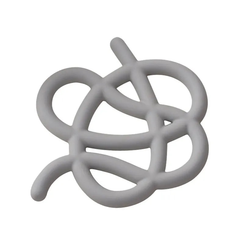 Ceramic heat proof mat in irregular shape on a wooden table