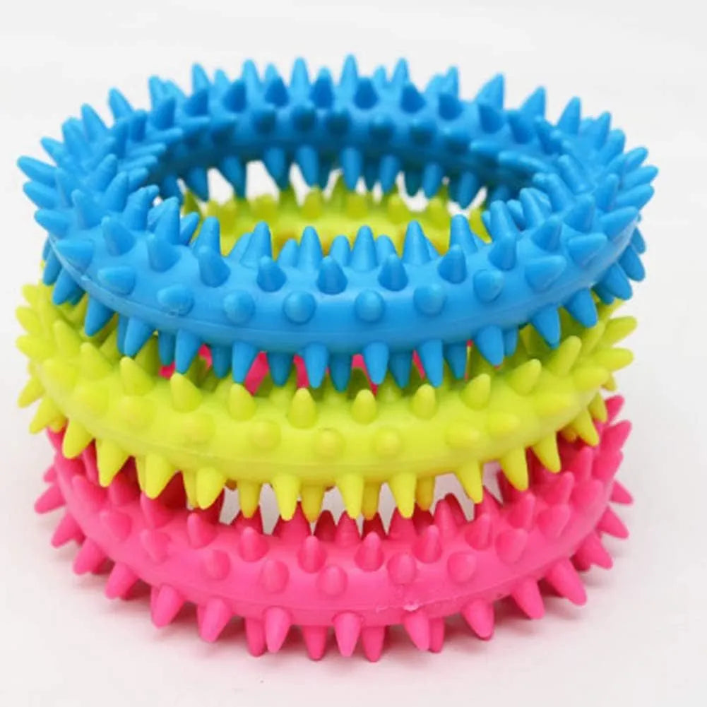 Blue TPR spiky circle ring dog chew toy for dental cleaning on a white background.