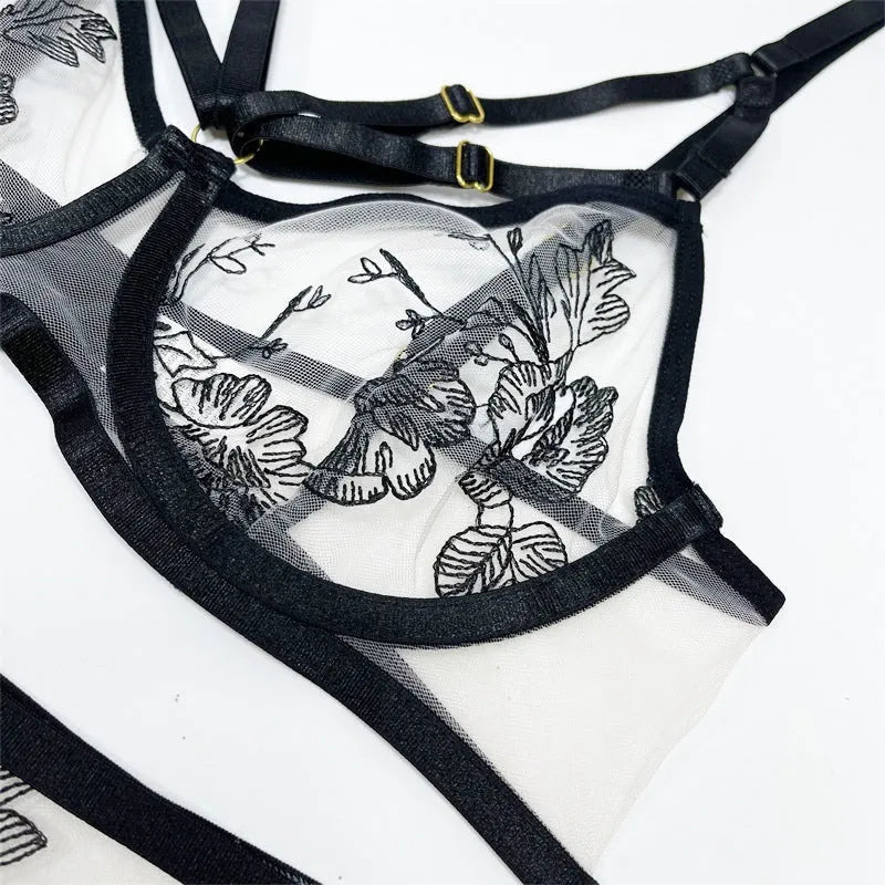Women's black lace mesh three-piece set showing crop top, high-waist pants and waist ring with floral print