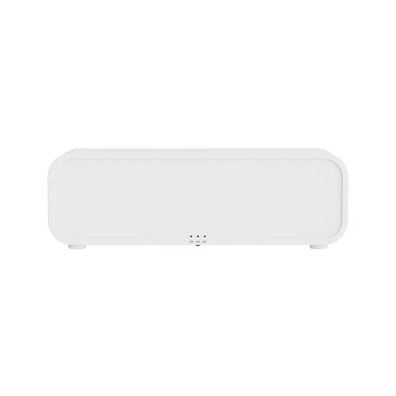 Black and white aroma diffuser with colour-changing LEDs, remote control, and USB cable.