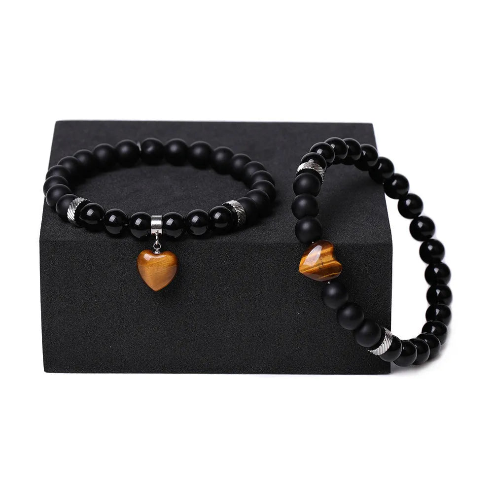 Polished natural stone couple heart bracelets in obsidian, agate, tigereye, crystal, aventurine, topaz, opal colours.