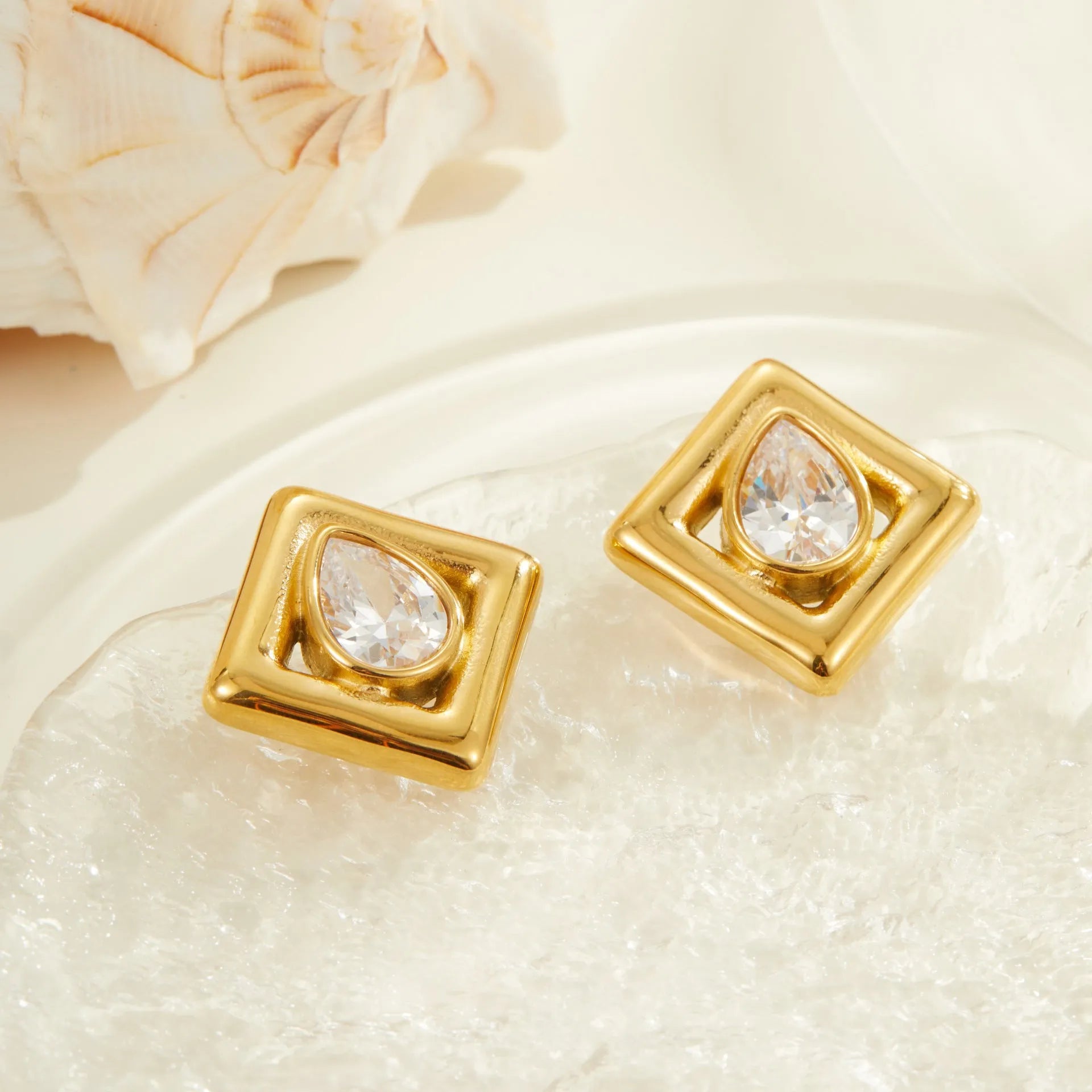 Gold geometric stud earrings with water drop zircon design on stainless steel