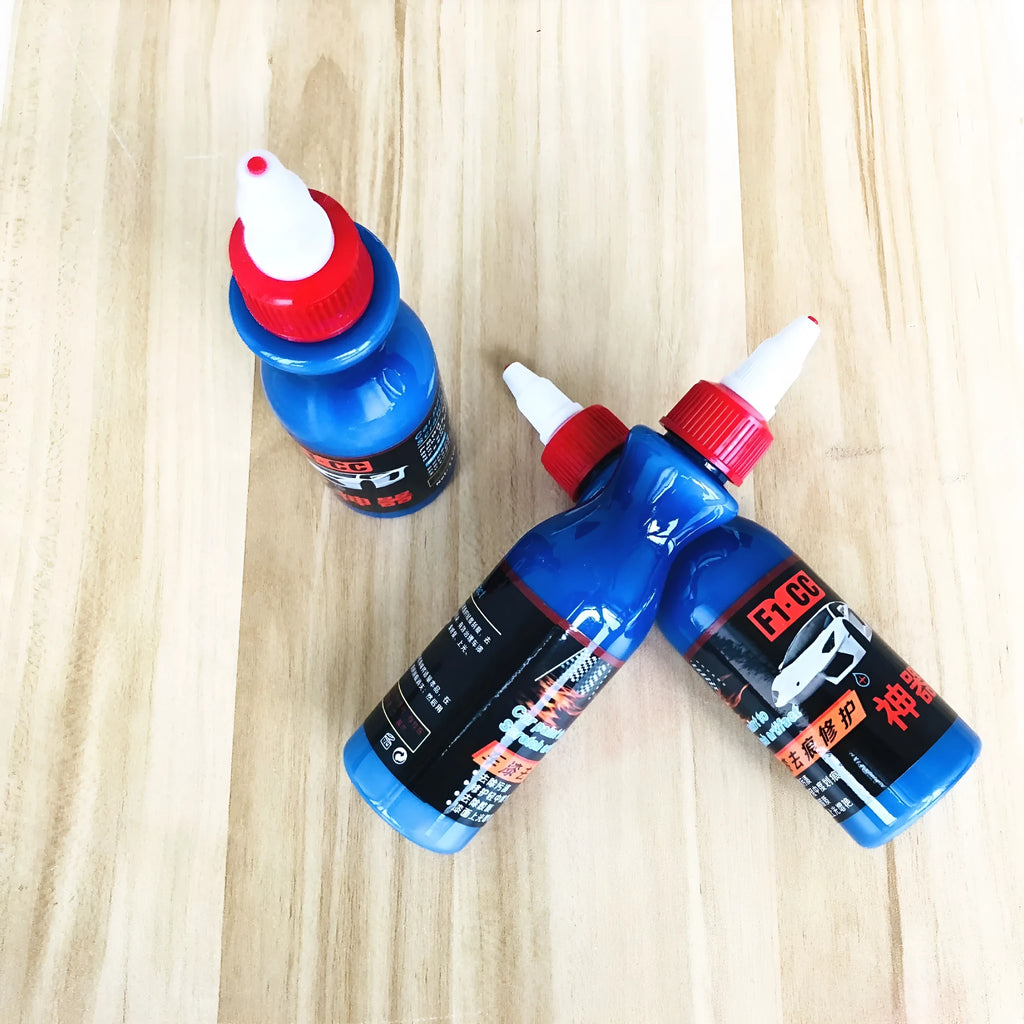 Small blue car wiping tool with scratch repair agent bottle for automotive paint touch-ups