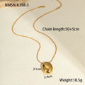 Gold geometric pendant necklace with adjustable chain on jewellery display