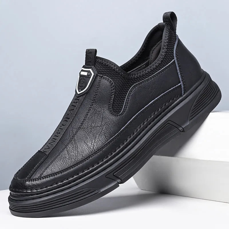 Men's solid colour leather casual shoes with round toe in Black and Brown options.