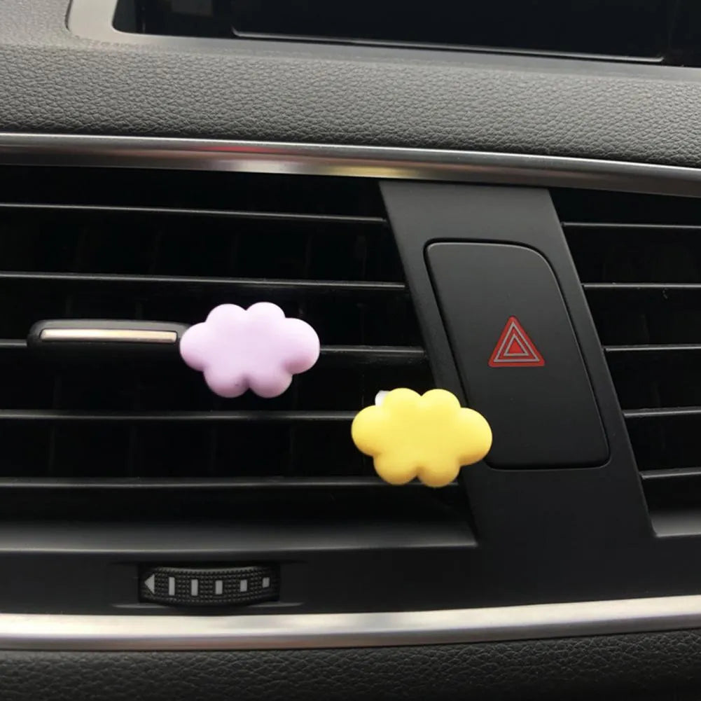 Resin car fragrance clip in pastel colours with cartoon cloud design for vent mounting