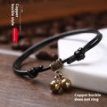 Adjustable nylon dog collar with brass bell on black rope, shown alongside red and coffee colour options.
