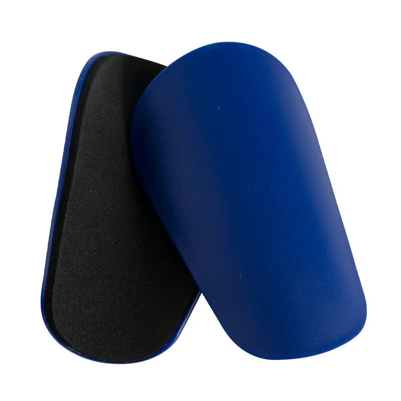PU mini shin guards in various colours on a leg, showing S and XS sizing for sports protection.