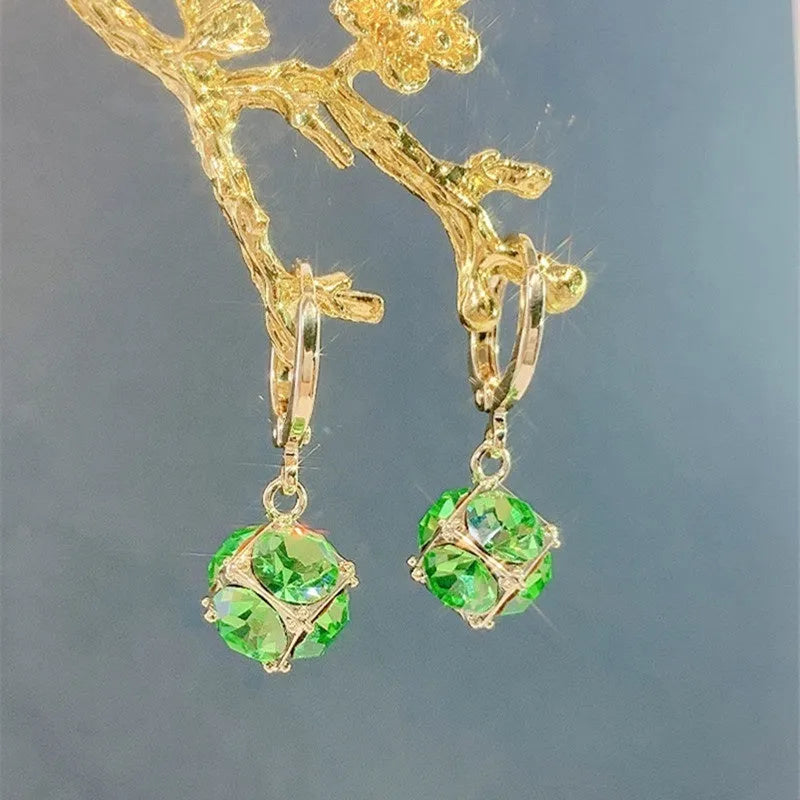 Geometric rose design copper earrings with zircon stones in an electroplated colour finish.