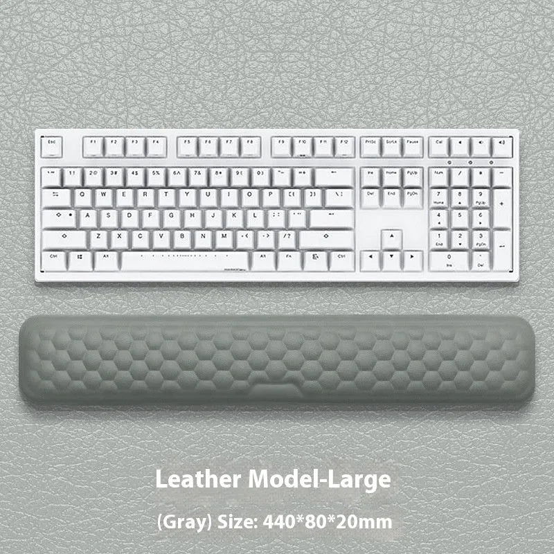 Memory foam mouse wrist pad with silicone bottom in black cloth cover on computer desk