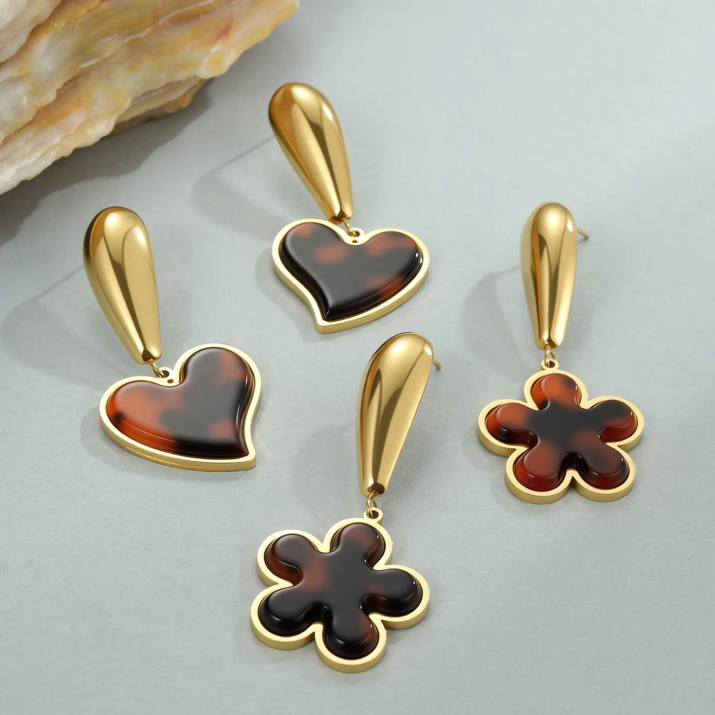 Women's tortoiseshell colour earrings with 18K gold plating, showing heart-shaped and floral geometric designs on a stainless steel base.