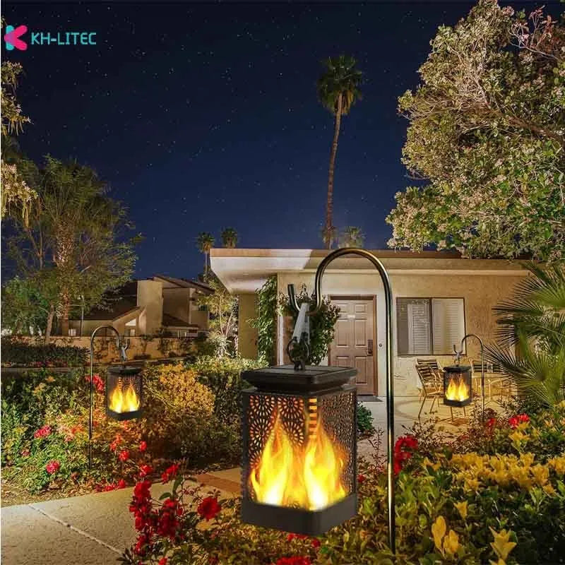 Four black solar-powered hanging torch lights with flickering flame LED effect for outdoor gardens.