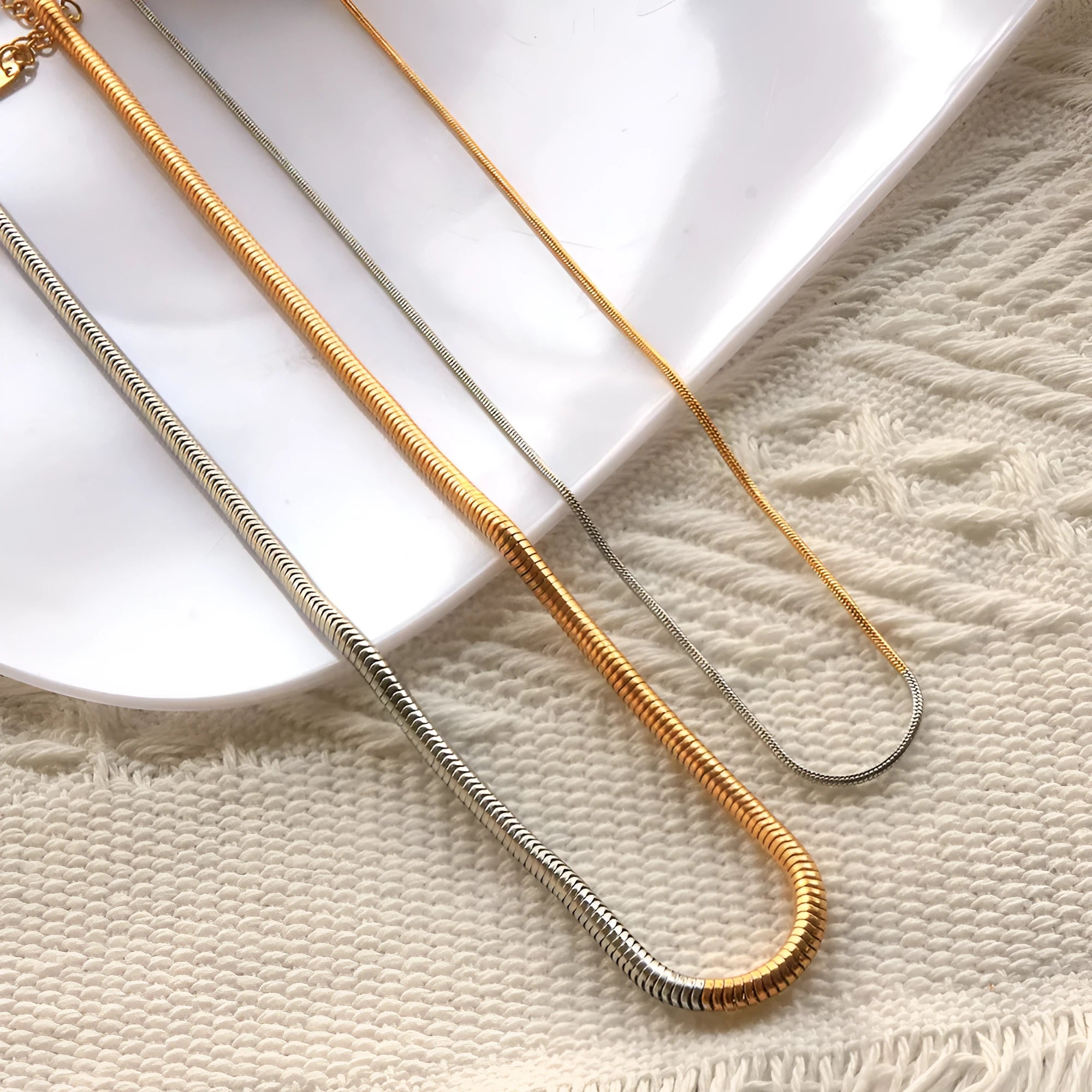 Golden tone stainless steel snake bones chain necklace with 3mm thickness and geometric pattern