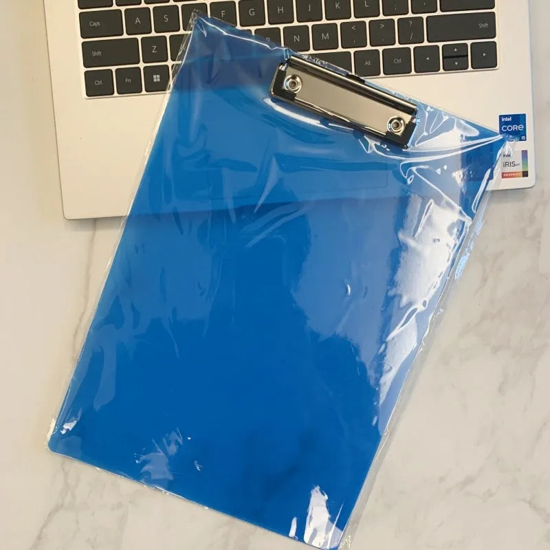 Transparent A4 clipboard with metal flat clip holding paper, shown in blue colour option.