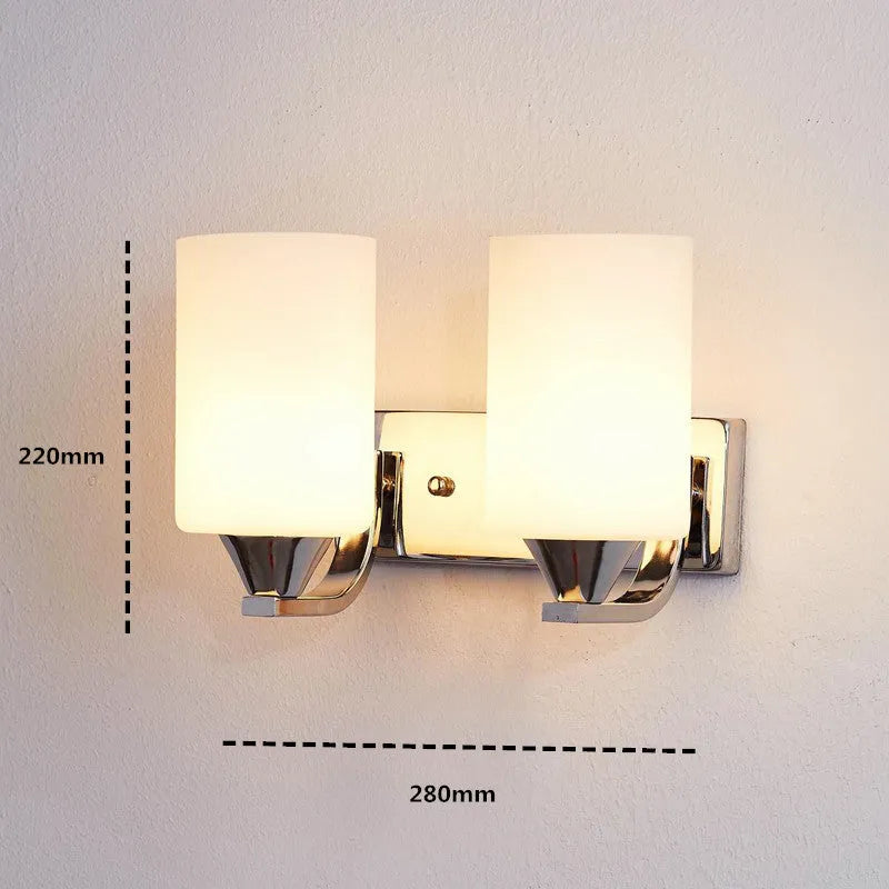 Chrome-finished minimalist glass wall lamp with adjustable dual heads for bedside lighting