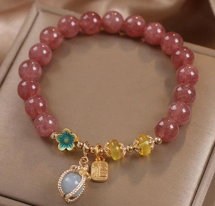 Red women's bracelet with strawberry quartz beads, alloy settings, and sparkling rhinestone details.