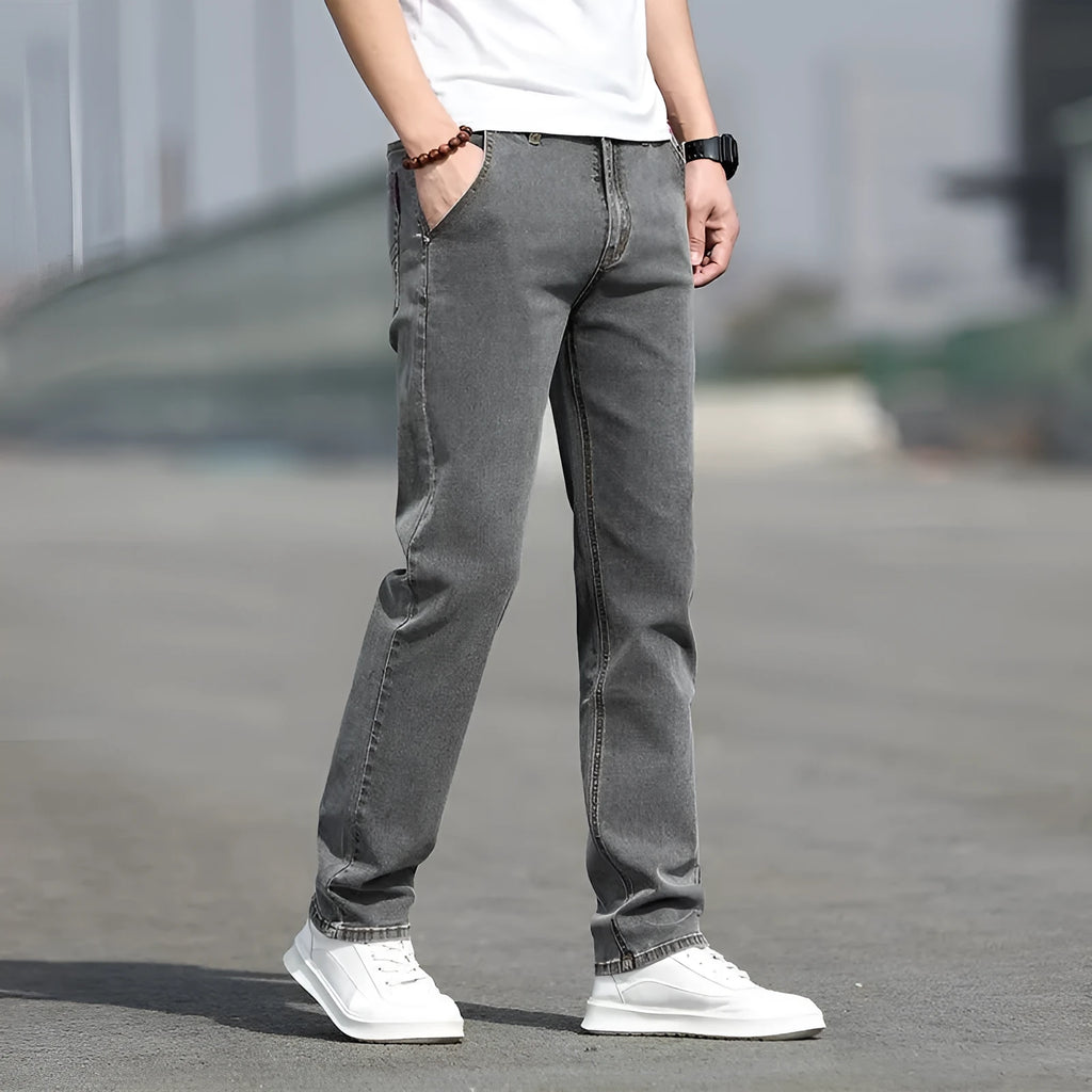 Men's straight leg jeans in smoky gray colour with low waist and zipper fly closure