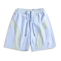 Men's loose fit quick-drying sports shorts in grey with elastic waist, shown above the knee.