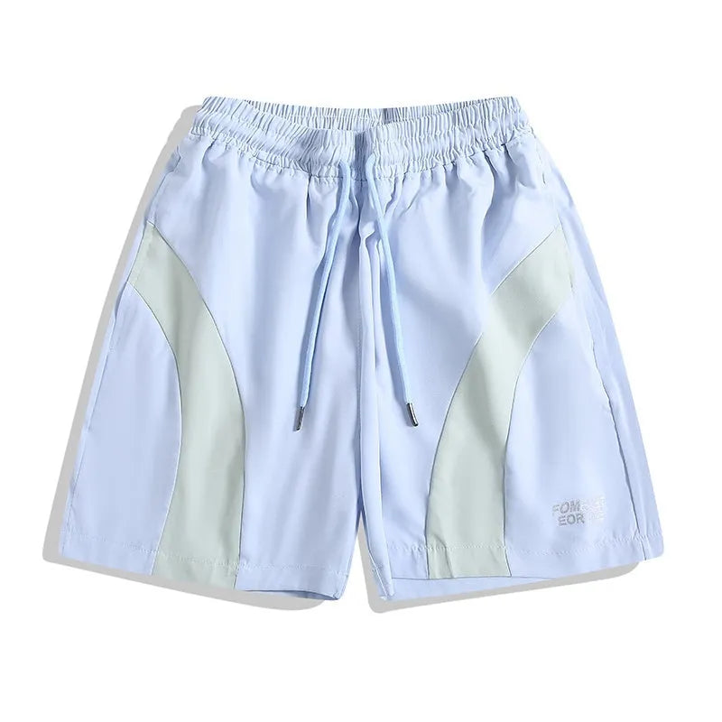 Men's loose fit quick-drying sports shorts in grey with elastic waist, shown above the knee.