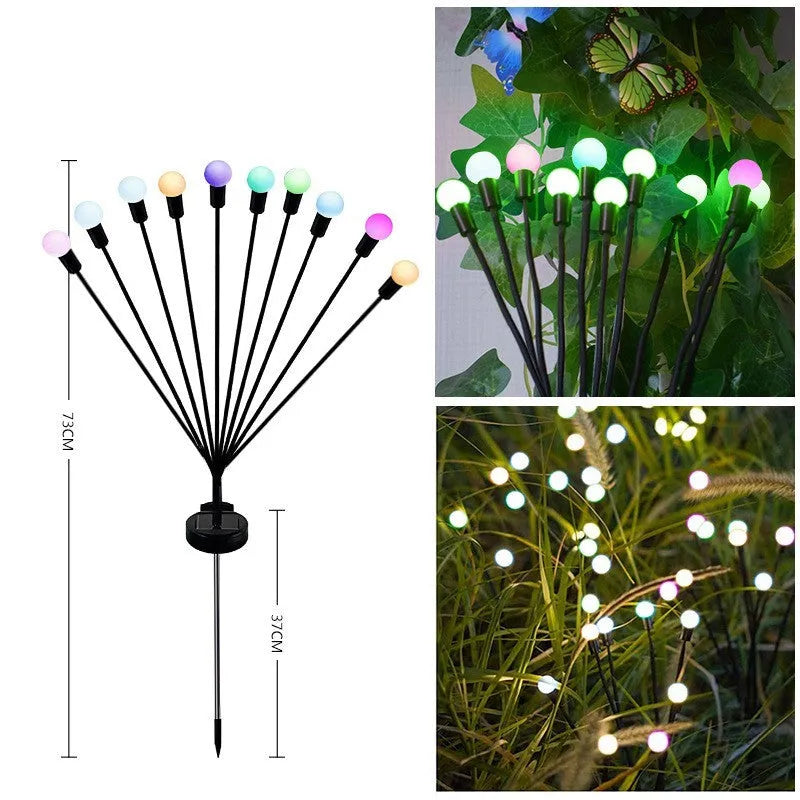 Solar-powered LED ground lamp with multiple heads inserted in garden soil alongside pathway