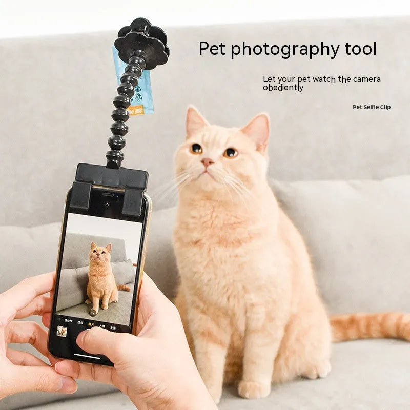 Plastic pet photography mobile phone holder with rotating treat clip in black or white colour