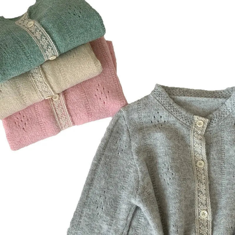 Women's loose artistic retro cardigan sweater coat in light grey viscose fibre, shown open as a layering piece.