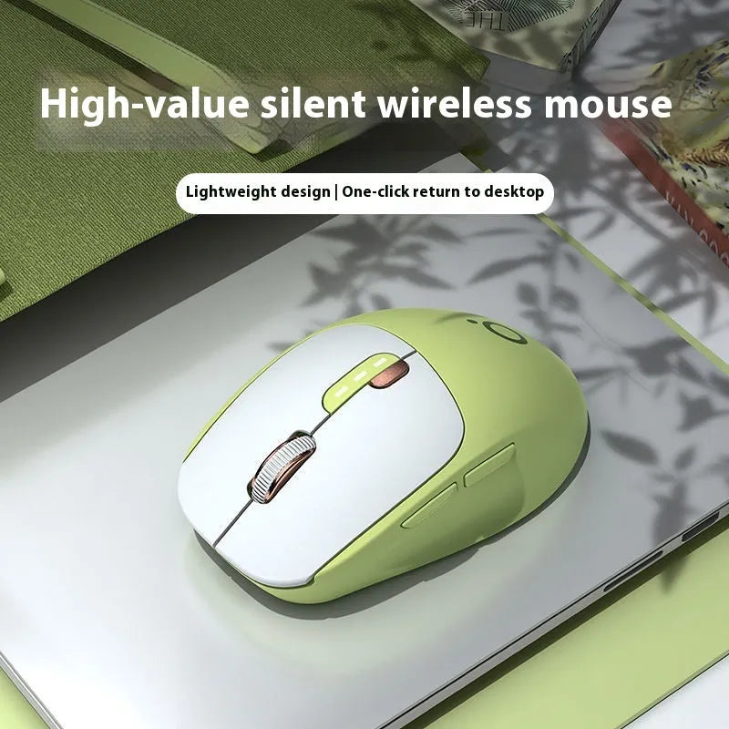 Mute wireless Bluetooth mouse in matcha green colour on a desk, showing ergonomic right-handed shape.