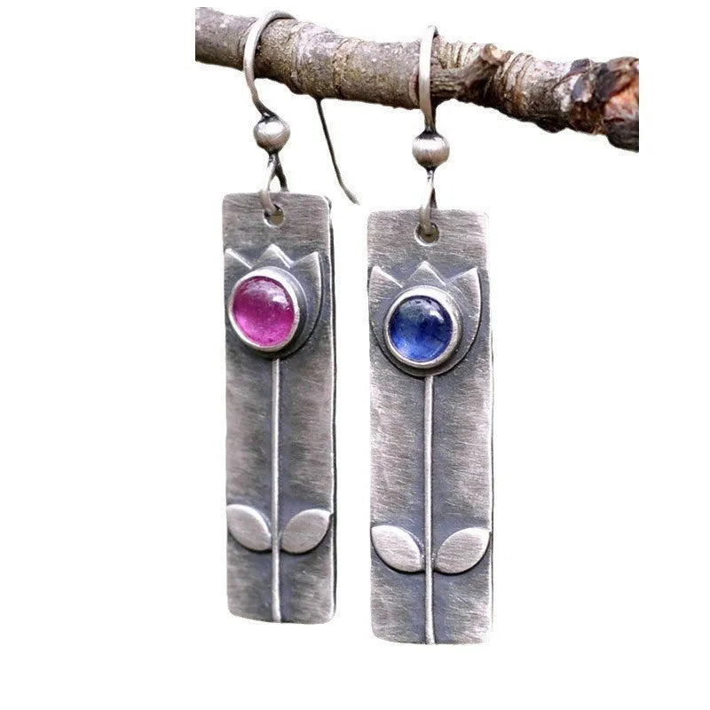 Antique finish geometric earrings with red sapphire ellipse details on electroplated metal