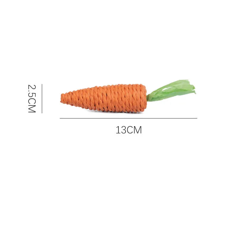 Bundle of cat toys including carrot-shaped chews, crinkly paper rings, and audible ringing stones in multiple sizes