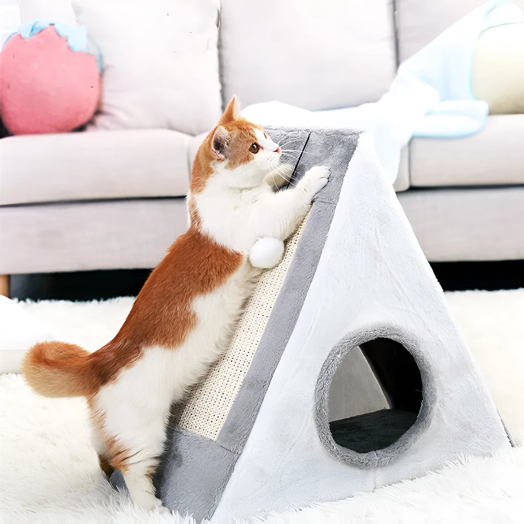 Triangular grey and white cat bed with sisal scratching posts on the sides.