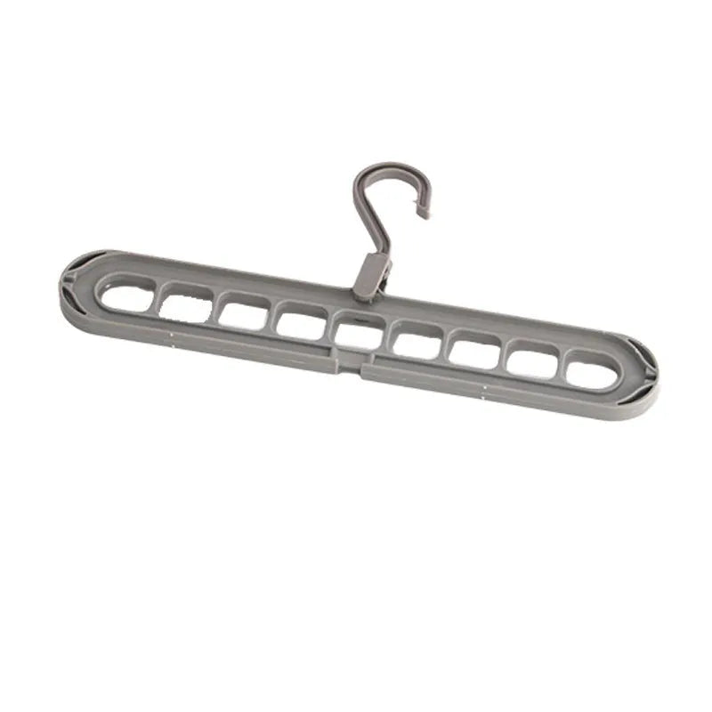 Plastic nine-hole folding trouser hanger in beige, blue, grey, green, or pink colour