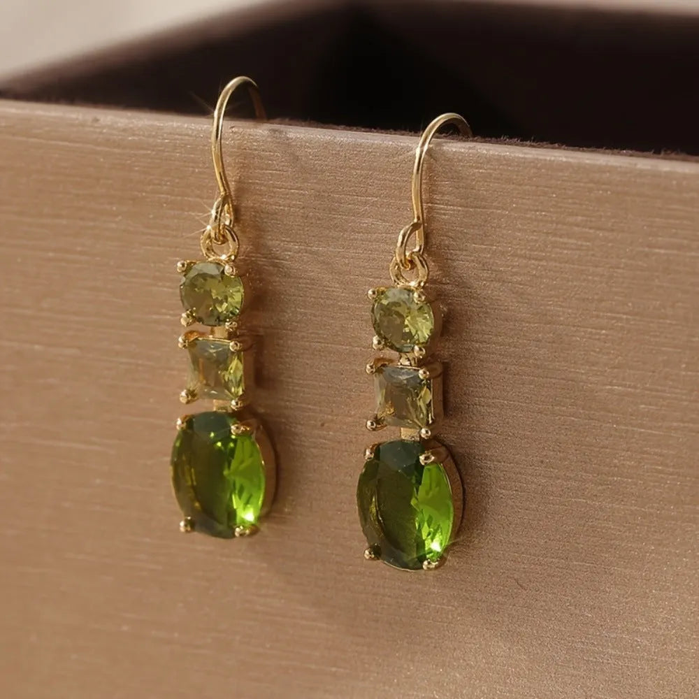 A pair of green geometric copper earrings with a quadrilateral shape in a retro bohemian style.