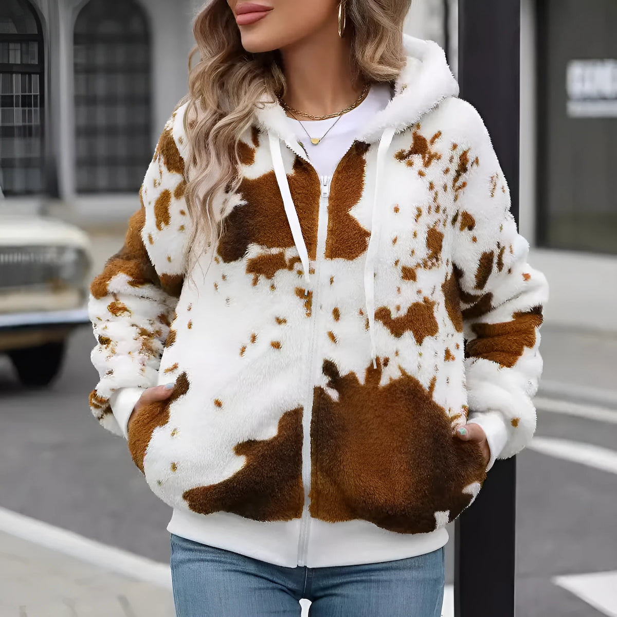 Yellow brown cow animal print hooded plush cardigan jacket with full zip and regular sleeves.