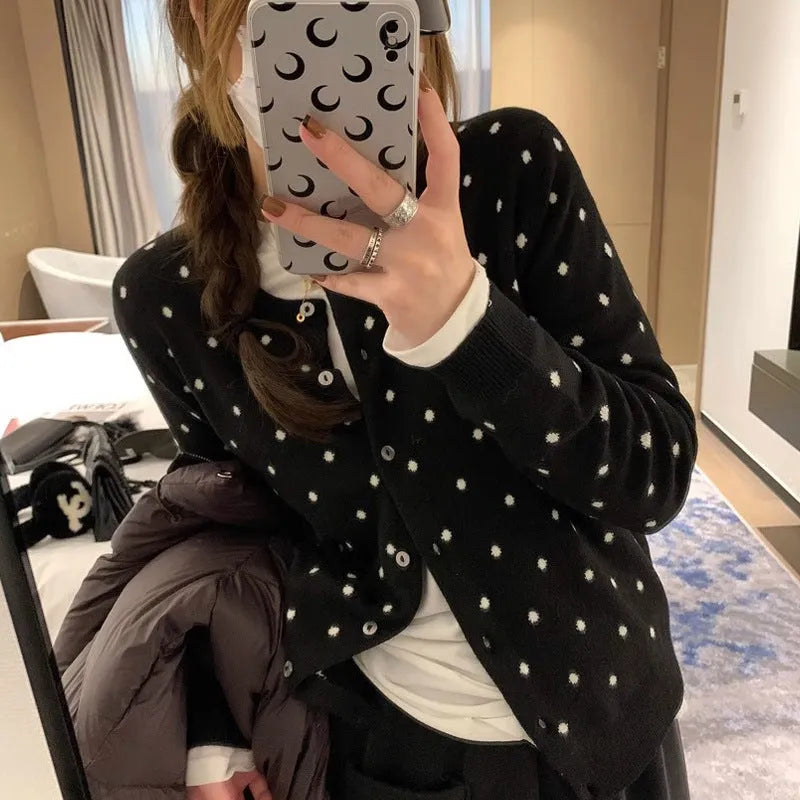 Women's grey dot knitted cardigan with long sleeves and crocheted flower detail