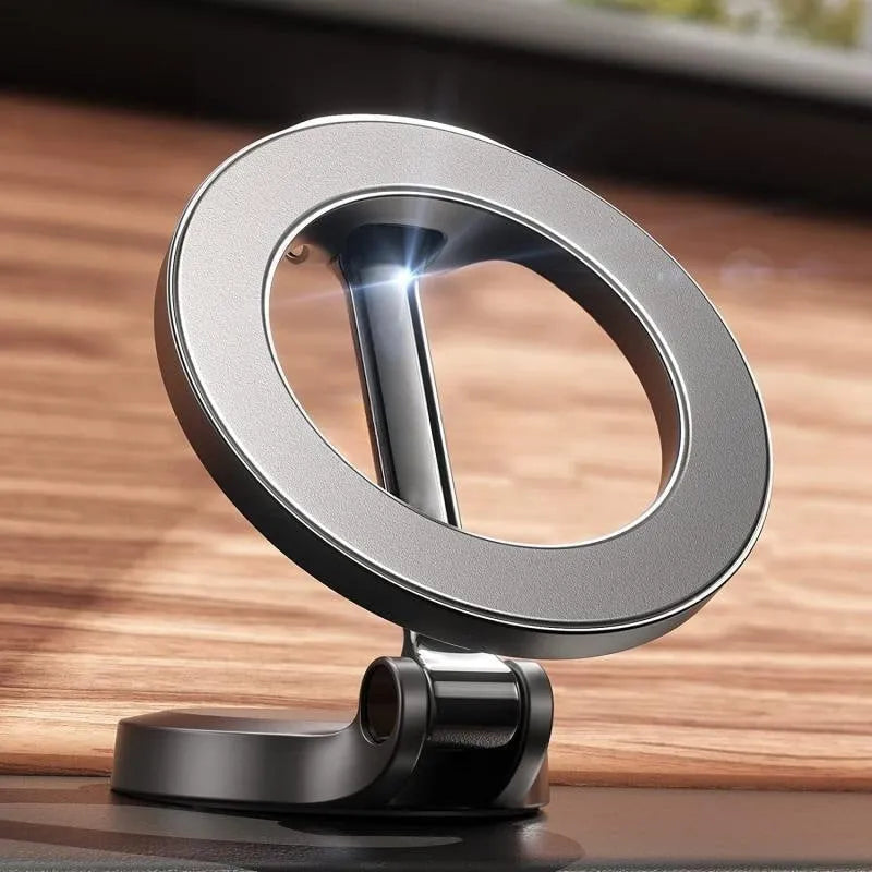 Black all-metal foldable magnetic car phone mount attached to a car dashboard.
