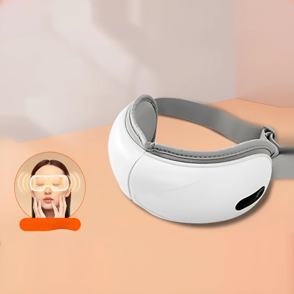 White rechargeable eye massager with airbag compression and heat therapy functions for relieving eye fatigue