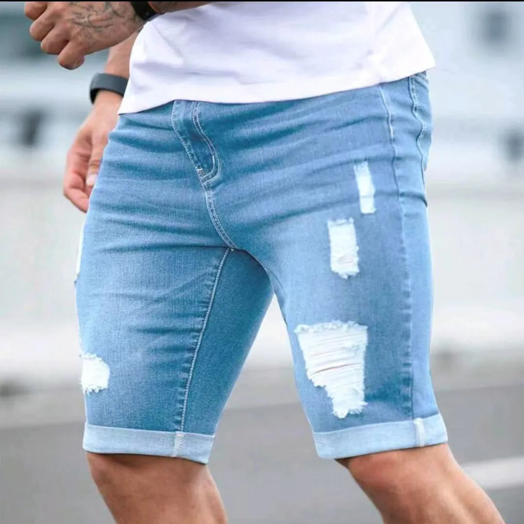 Sky blue distressed denim shorts with multi-hole design and low waist straight leg cut