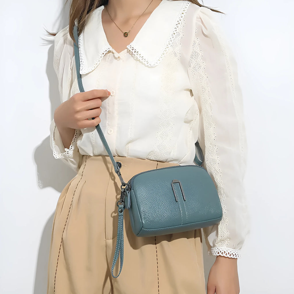 Black genuine leather women's square shoulder bag with a structured horizontal shape