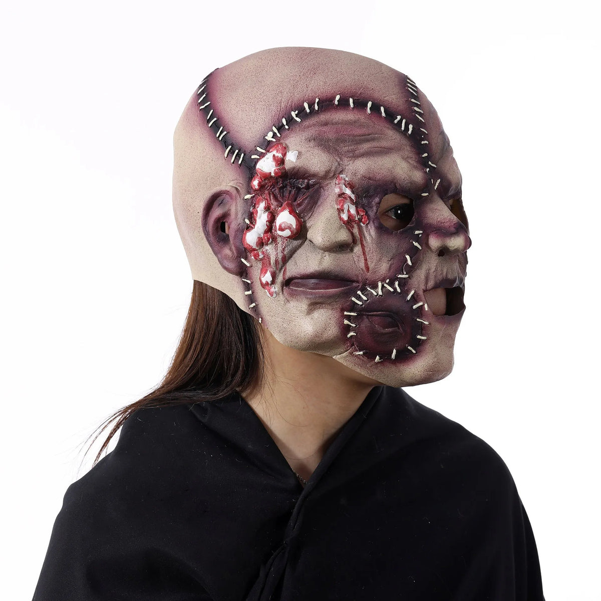 Three-sided grimace horror mask showing realistic facial texture made from natural latex