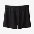 Men's solid colour cotton boxer shorts with a high waist and loose fit on a neutral background.
