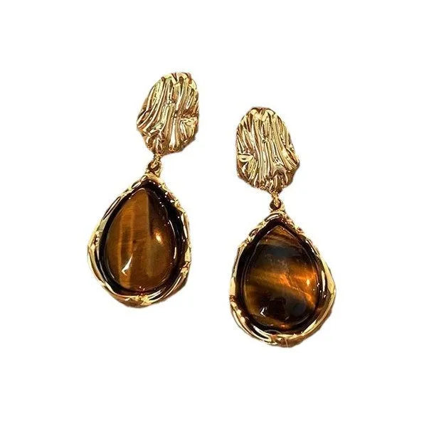 Three pairs of handmade geometric earrings with tassel details in gold electroplated finish