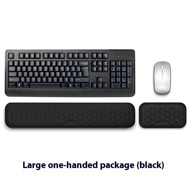 Memory foam mouse wrist pad with silicone bottom in black cloth cover on computer desk